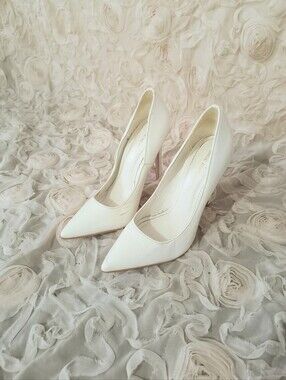 Classic White Patent Pointed-Toe Stiletto Pumps.